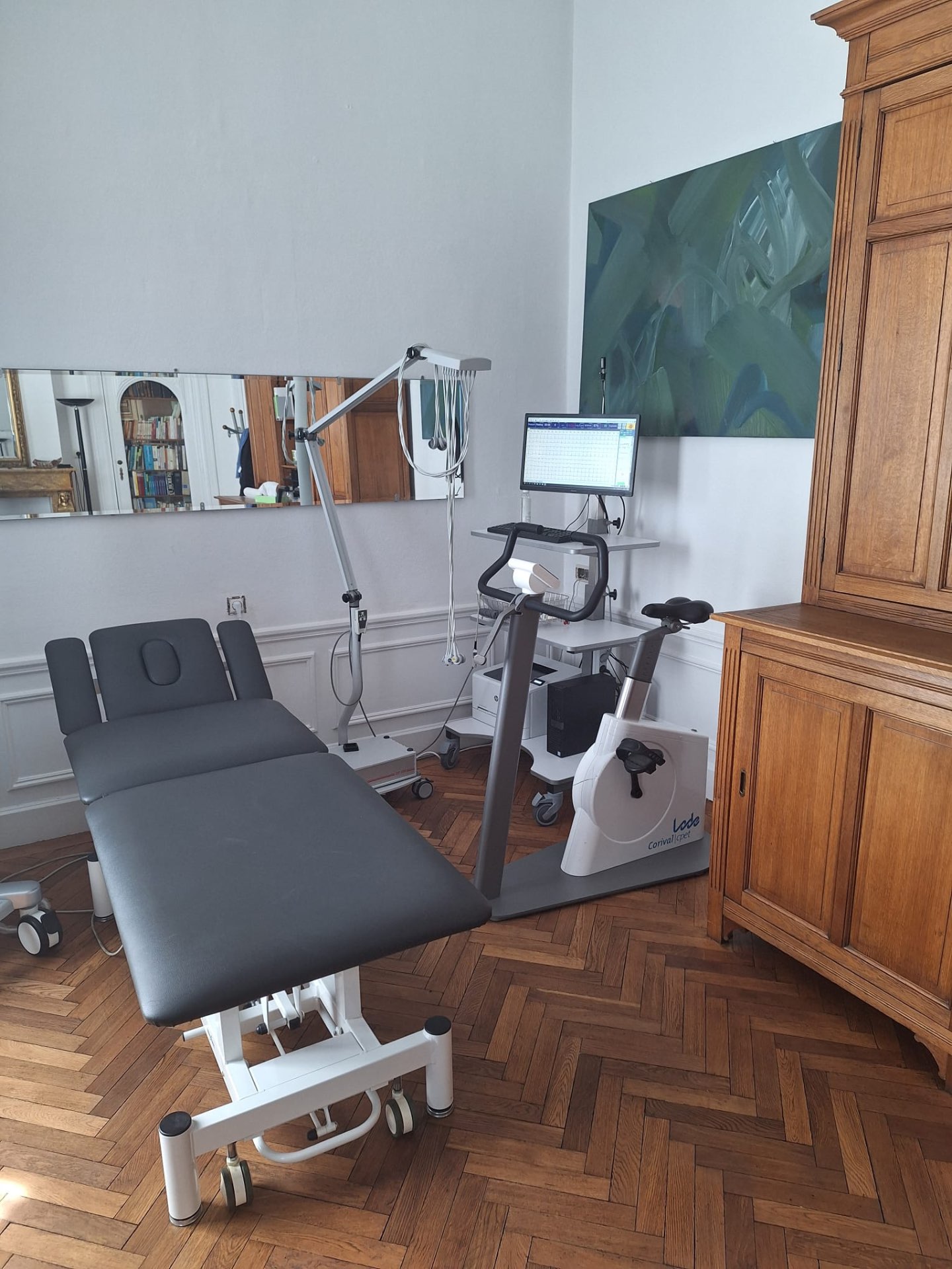 Examination bed and stress-test bicycle